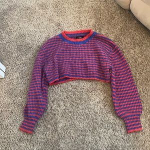are you selling a red and blue striped crop crew neck  sweater size medium